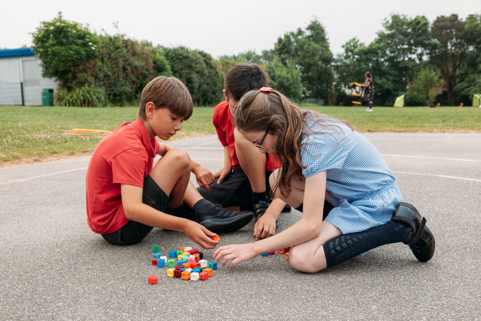 children enjoying a maths lesson outside